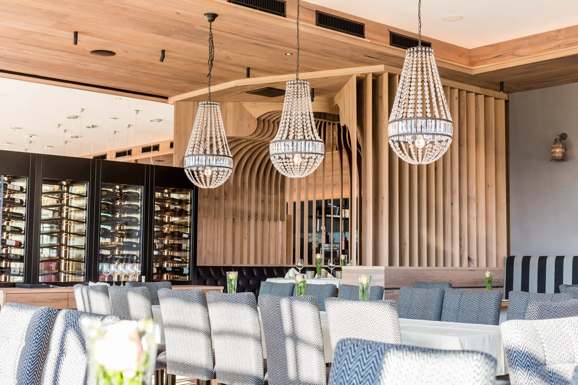 Woven pendant lamps and wine wall in the Greenvieh Greenside restaurant, Mieming Tyrol