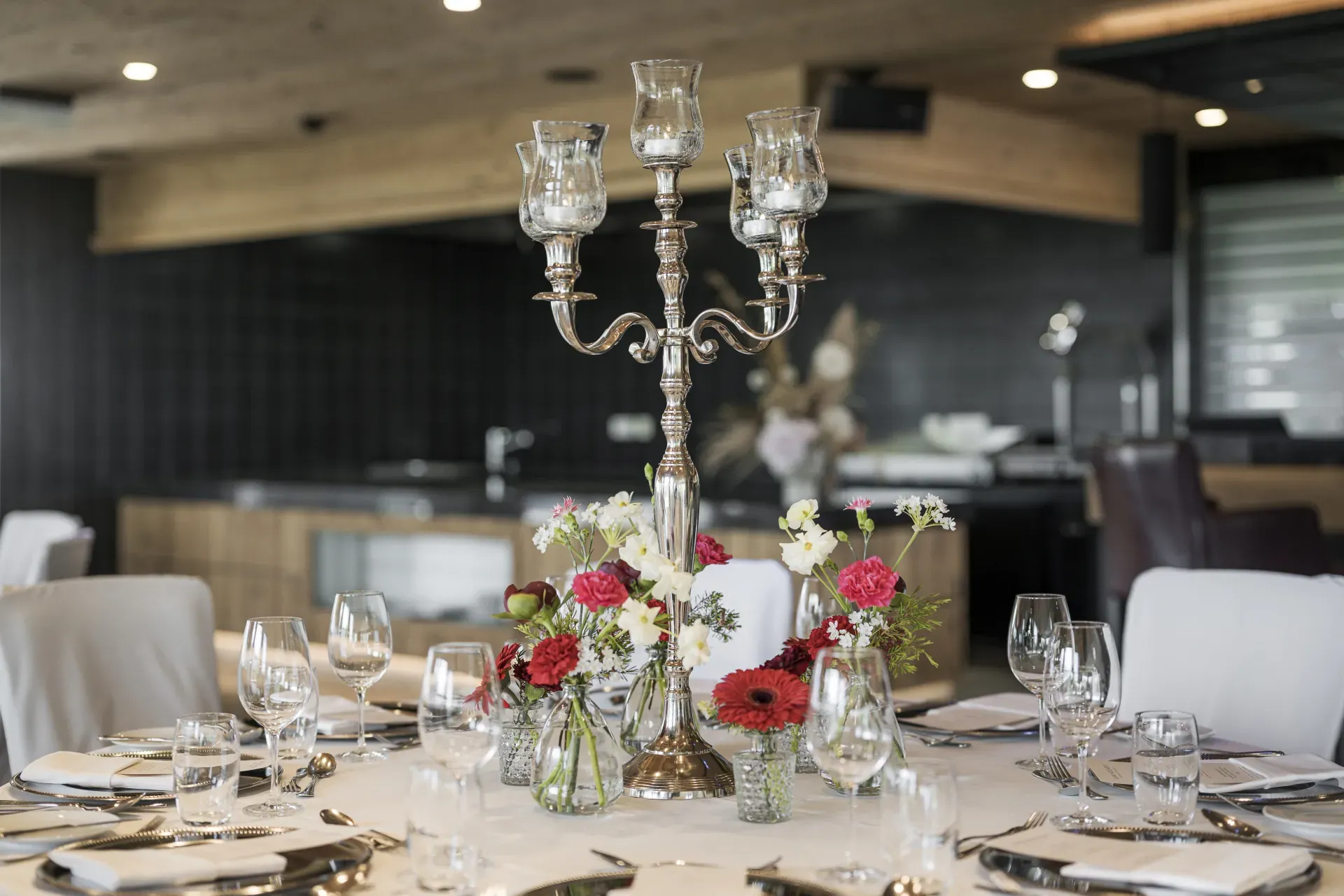 Silver candelabra with flowers as table decoration at the Greenvieh, Tyrol