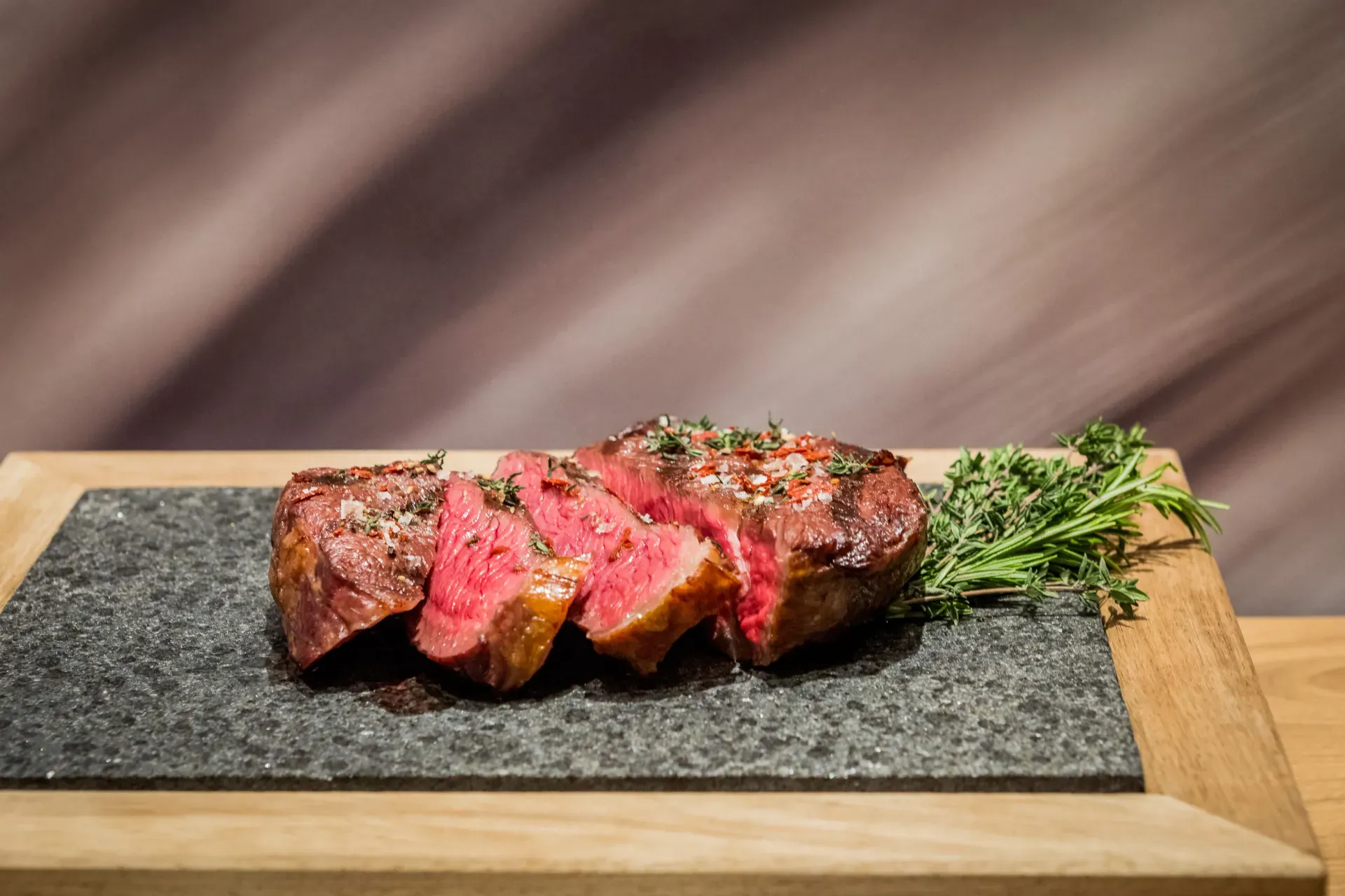 Juicy grilled steak with side dishes at the Greenvieh