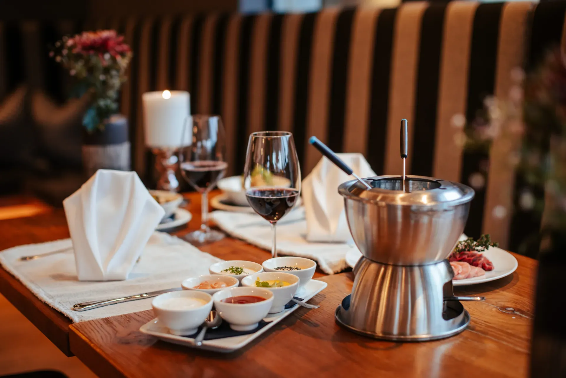 Convivial Fondue Chinoise at a laid table in the Greenvieh, Mieming